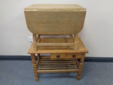 A blond oak flap sided coffee table together with a further blonde oak telephone table,