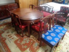 A twelve piece Chinese dining room suite comprising of four door low sideboard fitted drawers above,