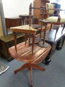 A contemporary flap sided kitchen table together with a smoker's stand,