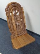 A heavily carved African fertility chair carved with an elephant