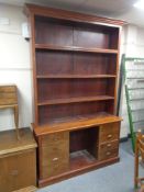 A set of early 20th century open bookshelves on sideboard,