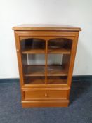 A contemporary teak audio cabinet