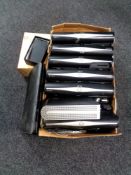 A box containing Sky and Virgin Media boxes, mobile phone,