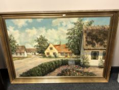 Continental school : A thatched cottage in a village, oil on canvas,