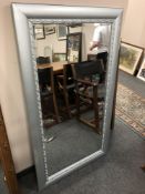 A chrome effect mirror 79 x 140 cm