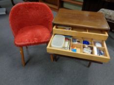 A 20th century walnut sewing cabinet fitted three internal drawers with contents on raised legs,