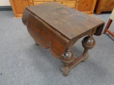 A 20th century flap sided coffee table on bulbous legs