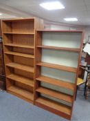 Two sets of teak effect open bookshelves