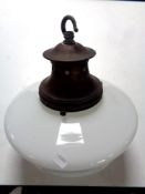 An antique opaque glass hanging light fitting