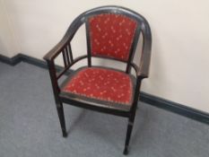 A 20th century ebonised beech armchair