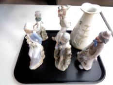 A tray containing a Lladro figure, lady seated with flowers,