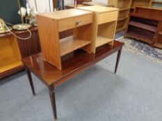A rectangular coffee table in a mahogany finish together with two bedside stands fitted a drawer