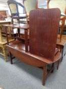 A rectangular mahogany flap sided coffee table together with a further pair of coffee tables in a