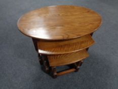 A nest of three oak tables