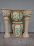 Three glazed pottery jardinieres on stands