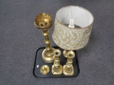 A tray containing brass table lamp with shade, pair of antique brass candlesticks, candle snuffer,