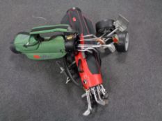 Two golf bags containing assorted irons,