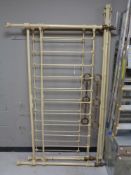 A 6 ft antique painted cast iron and brass bed frame