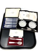 A tray containing a cased set of six silver handled butter knives,