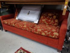 A three seater settee in floral fabric