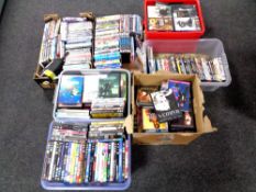 Seven boxes containing a quantity of assorted DVDs