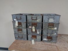 Twelve galvanized metal troughs with handles