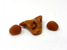 A pair of 9ct gold mounted amber earrings together with a similar brooch with silver gilt pin