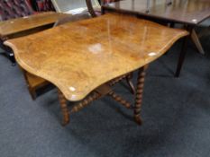 A Victorian walnut Sutherland table.