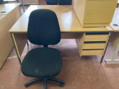 A beech effect three drawer desk, width 153 cm, together with a swivel chair.