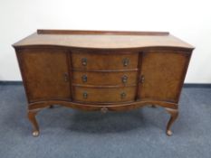 A walnut Queen Anne serpentine fronted sideboard