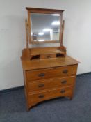 An Edwardian satin wood dressing chest