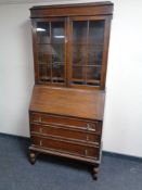 An Edwardian oak bureau bookcase