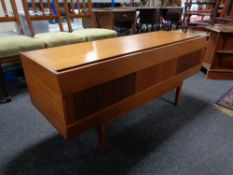 A mid 20th century teak HMV gramophone cabinet (lacks contents)