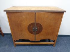 A 20th century double door serving cabinet,