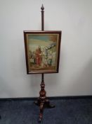 A Victorian mahogany tapestry pole screen