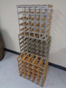 Three wooden and metal wine racks