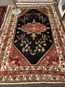 An antique Persian Kaoliyai carpet 257 cm x 170 cm