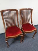 A pair of antique mahogany dining chairs