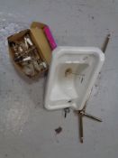 A Waverley ceramic sink with brass taps