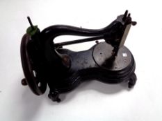 An antique hand sewing machine.