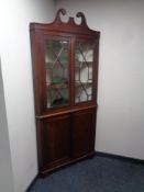 A 19th century double door mahogany corner cabinet fitted cupboards beneath