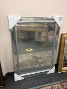 An all glass mirror 74 x 105 cm