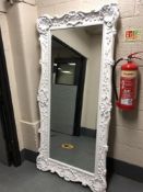 An ornate white framed contemporary mirror 98 x 199 cm CONDITION REPORT: Frame