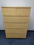 An Ikea six drawer chest in a pine finish