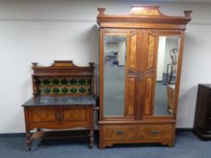 A mahogany and walnut three piece Arts & Crafts bedroom suite comprising of double mirror door