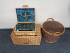 A wicker twin handled log basket together with a wicker cased picnic set and a further wicker