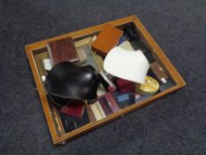 A counter top display cabinet containing a large quantity of assorted jewellery boxes,