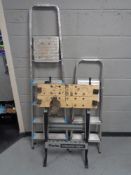 Two sets of folding aluminium steps together with a folding Clarke Strong-arm folding workbench