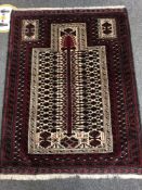 An Afghan prayer rug 131 x 100 cm