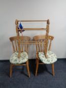 A set of four pine farmhouse kitchen chairs and a pine towel rail